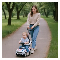 Zenélő bébitaxi vezetőrúddal Baby Mix MENTŐAUTÓ fehér